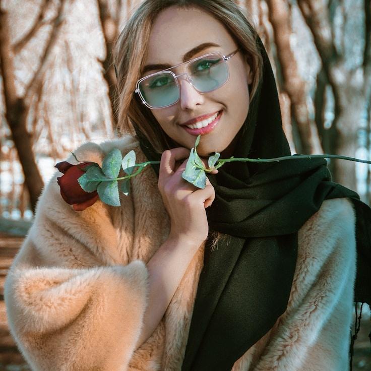 Kaveri Mehta, Lead Design Curator at Calm Canvas Space, reviewing corporate floral arrangements